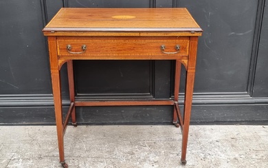 An Edwardian mahogany and inlaid writing desk, with fol...