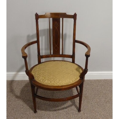 An Edwardian mahogany inlaid oval open Arm Chair, with uphol...
