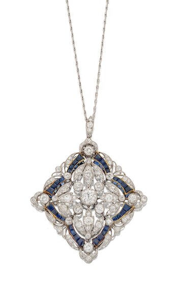 An Edwardian, platinum, diamond and sapphire pendant necklace, designed as an old-brilliant-cut diamond-set lozenge shaped openwork panel with central millegrain-set principal diamond within diamond foliate surround and calibre sapphire detail, to...