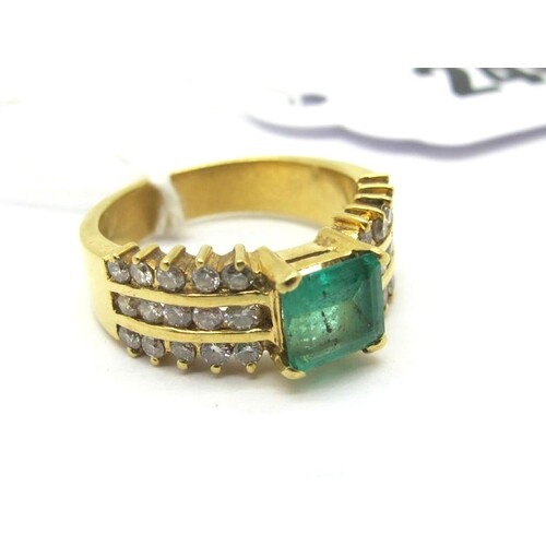 An Emerald and Diamond Set Ring, square claw set to the cent...