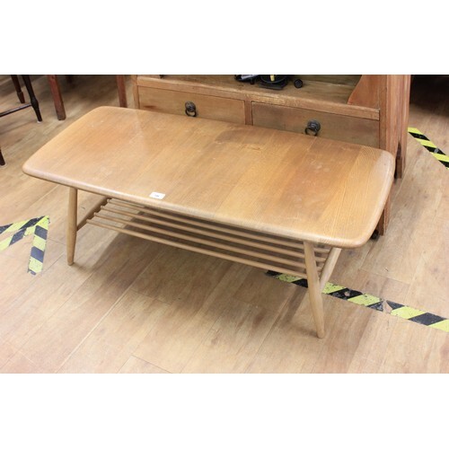 An Ercol pale elm and stained beech coffee table, 104 cm lon...