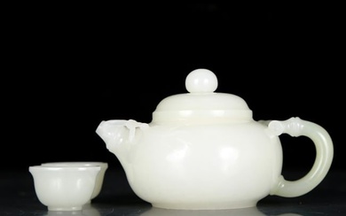 An exquisite white jade teapot with two small cups