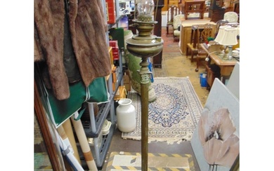 Antique brass oil lamp, set on a corinthian column, 65" high...