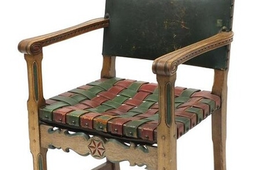 Carved oak open arm chair with red and green leather