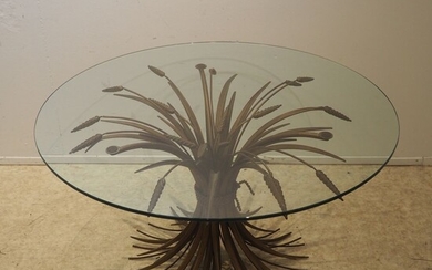 Coco Chanel attribué : Table basse vers 1950, plateau circulaire en verre clair posé sur...