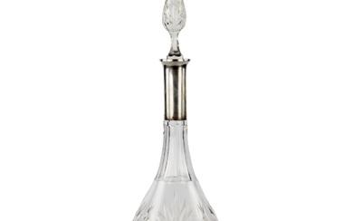 Crystal decanter with a silver neck.