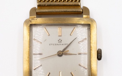 ETERNA-MATIC Montre bracelet d'homme en or jaune (750). Boîtier carré, cadran à fond argenté, signé,...