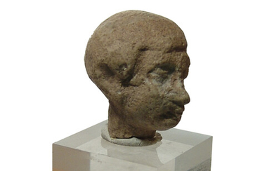 Egyptian terracotta head of a man wearing a wig