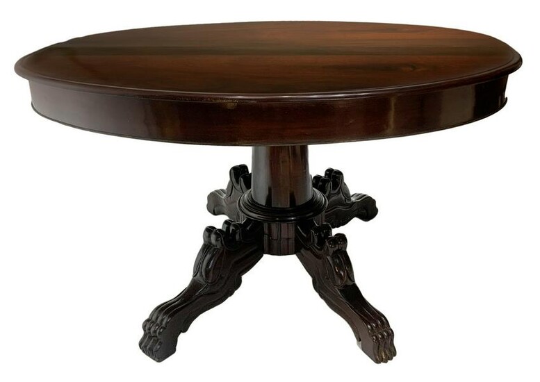 Extending oval dining table in rosewood. Four-spoke