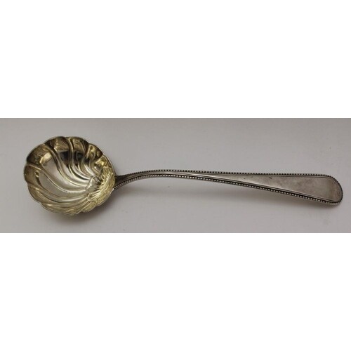 GEORGE SMITH An 18th century silver ladle, shell bowl & bead...
