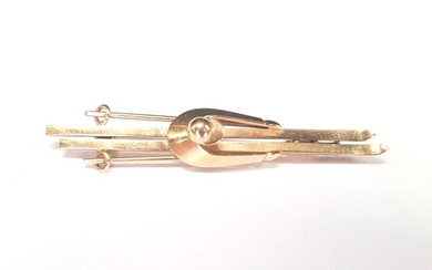 Gold 750 Spindle ‰ featuring a stylized skier, weight 7.3 g