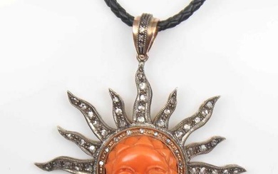 Gold pendant with diamonds and cut coral Gold, 375th proof, silver, diamonds, coral, leather strap. Weight 23 g, 6.5 cm