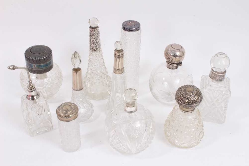 Group of silver mounted cut glass scent bottles