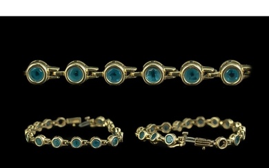 Ladies 14ct Yellow Gold Line Bracelet, set with round blue T...