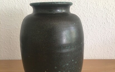 Lauritz Hjorth: A stoneware vase decorated with greenish glaze. Signed L. Hjorth, Danmark. H. 21 cm. Diam. 14 cm.