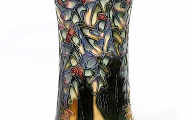 MOORCROFT; a tall vase decorated with a woodland scene, impressed...