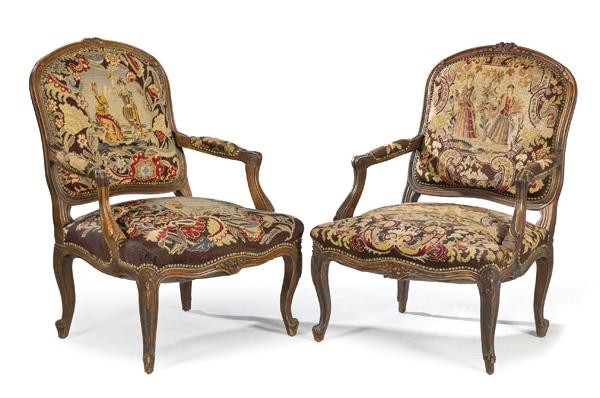 Pair of Louis XV style armchairs, in carved walnut with