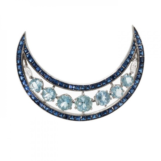 Platinum half moon brooch with aquamarines and sapphires.