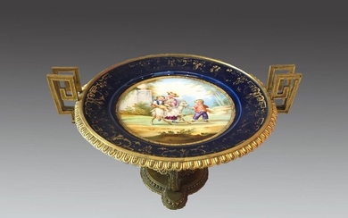 Porcelain and gilt bronze bowl with a central painted decoration of children playing with a goat (some wear and tear).