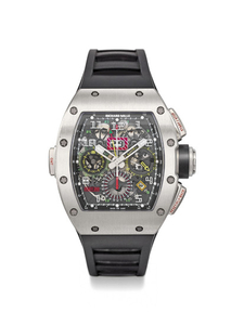 RICHARD MILLE. A VERY RARE AND IMPRESSIVE TITANIUM AUTOMATIC SEMI-SKELETONIZED FLYBACK CHRONOGRAPH WRISTWATCH WITH DUAL TIME, OVERSIZE DATE, MONTH, ORIGINAL WARRANTY AND BOX, SIGNED RICHARD MILLE, RM11-02, REF. RM11-02 AO TI / 074, MOVEMENT NO. 5707,...