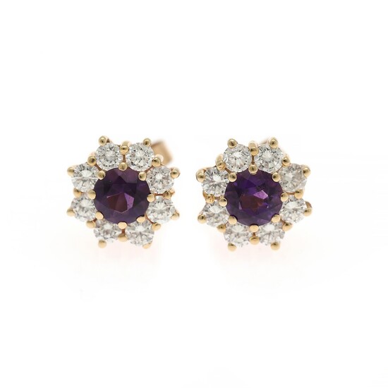 Ruben Svart: A pair of amethyst and diamond ear studs each set with a circular-cut amrethyst encircled by numerous brilliant-cut diamonds, mounted in 14k gold.
