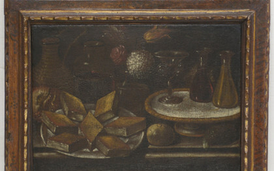 Scuola spagnola del secolo XVII "Vetri, vivande e fiori" olio su tela (cm 46x60). In cornice antica (difetti e restauri)