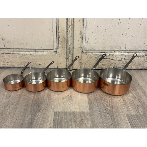 Set of five French copper sauce pans, stamped Tournus to han...