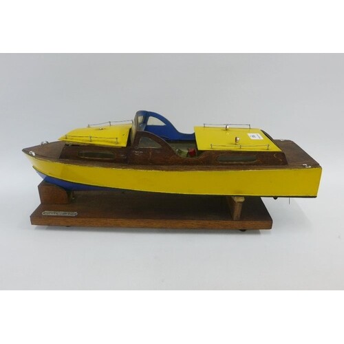 Silver Mist, a hand build model wooden boat with a small die...