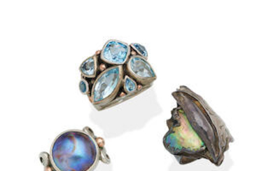 THREE GEM-SET SILVER AND GOLD RINGS