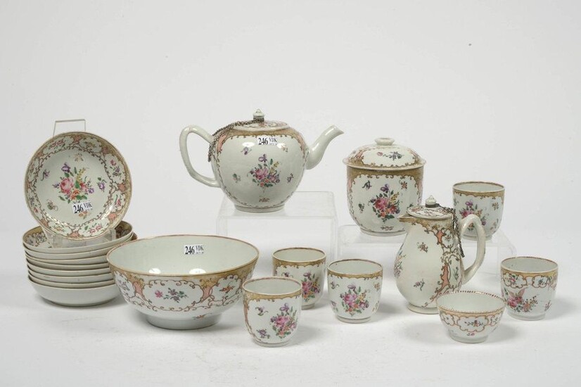 Tea service part of 19 pieces in polychrome porcelain of China with floral decoration in reserves on a gold background of two different models including: a bowl, five cups, a pouch, 9 saucers, a selfish pourer, a sugar bowl and a teapot. Period: 18th...