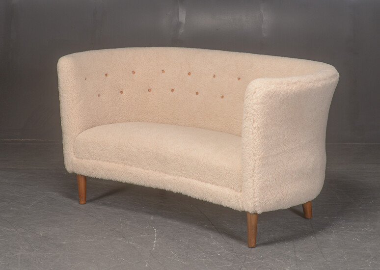 Two-seater sofa, the middle of the 1900th century, upholstered in lamb wool.