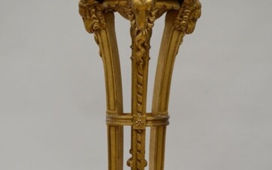 Une colonne en bois doré à têtes de bélier (h115cm) (*)