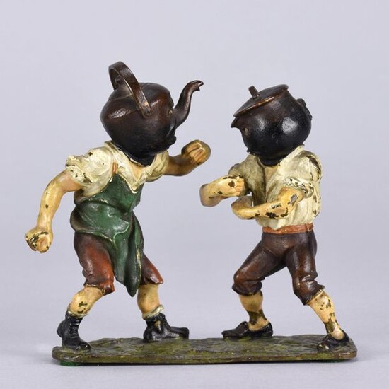 Vienna Bronze (early 20th Century) A cold painted bronze group of a pot and kettle fighting animated as two young men. Titled 'Pot calling the Kettle black'. Circa 1900. Height 11 cm.