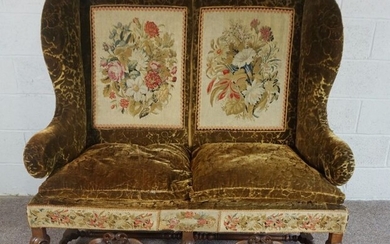 Walnut Framed Wing Back Settee, In Jacobean style, set with tapestry panels, on scroll legs and