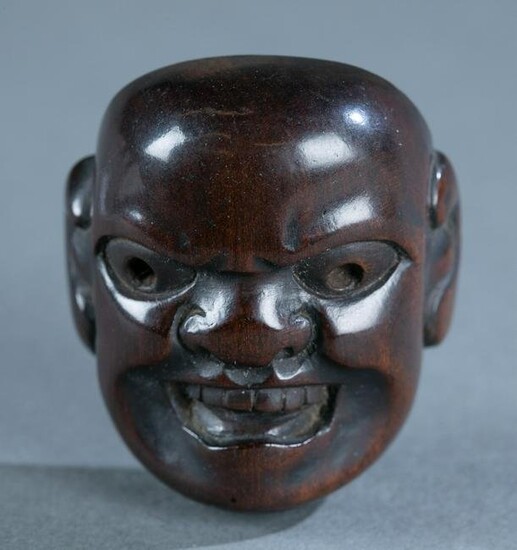Wood mask netsuke signed Masachika, 19th century.