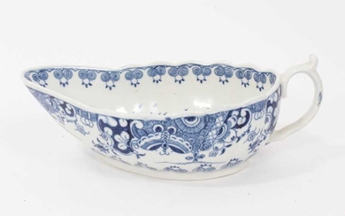 Worcester sauceboat, circa 1770, painted in underglaze blue with the Doughnut Tree pattern, 18cm long