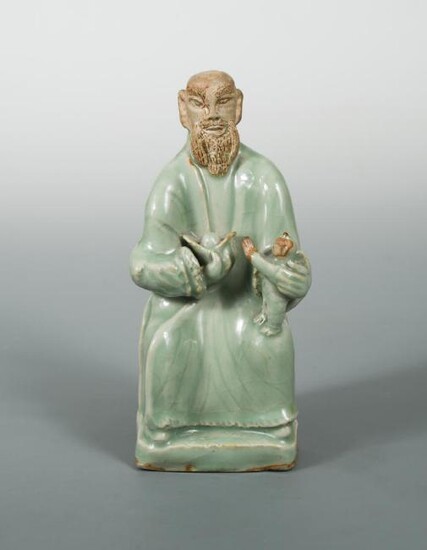 A Ming dynasty Longquan celadon figure of Fuxing