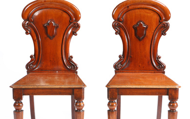 3376747. A PAIR OF VICTORIAN ARMORIAL BACK MAHOGANY HALL CHAIRS ATTRIBUTED TO W. BLACKIE.