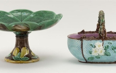 TWO MAJOLICA TABLEWARES Both unmarked. 1) Water lily-form tazza. Diameter 10.25". 2) Ovoid basket with lattice-work ground and faux...