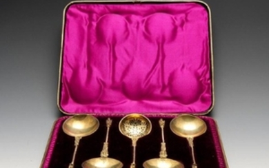 A cased Victorian silver-gilt fruit serving set of four