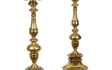 A pair of gilt and turned torches