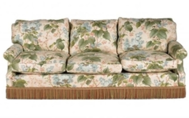 An upholstered three seat sofa