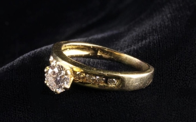 A 14 Carat Yellow Gold & Diamond Ring set with a round brilliant cut diamond measuring approx 5.01 m
