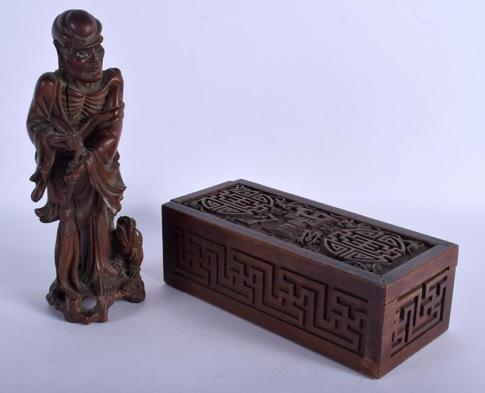 A 19TH CENTURY CHINESE CARVED HARDWOOD FIGURE OF AN