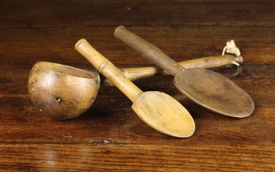 A 19th Century Treen Ladle & Two Treen Spoons. The ladle having a globular bowl pierced with drainin