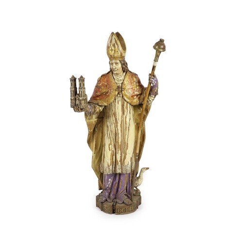 A 19th century German painted carved wood figure of St Ludge...