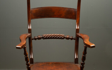 A 19th century high back Oxford pattern armchair
