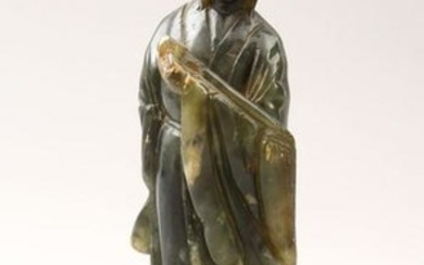 A 20TH CENTURY CHINESE CARVED JADE FIGURE OF GUANYIN