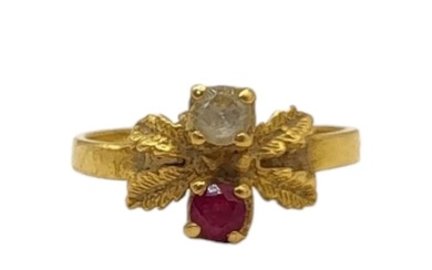 A 22CT GOLD AND RUBY RING The single round cut stone set in ...