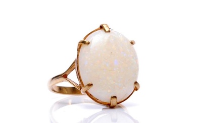 A 9ct hallmarked single stone opal ring, claw set oval stone...